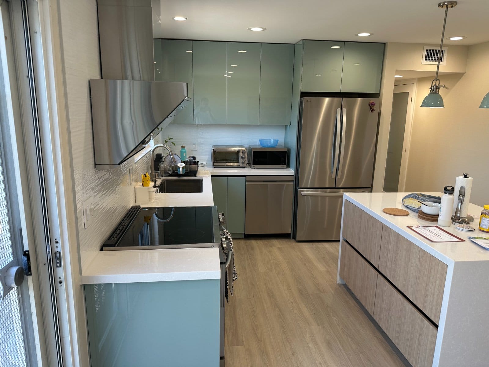 Glossy light green kitchen after a completed Bay Area home remodel