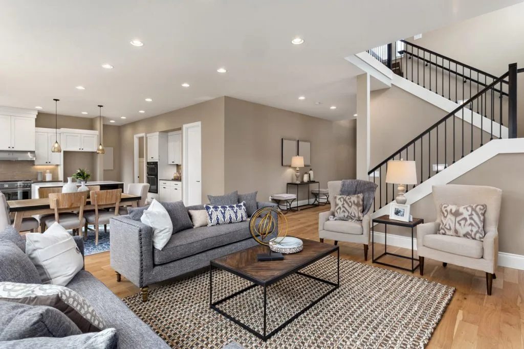amazing living room with baseboard trim and ceiling potlights - home remodeling company